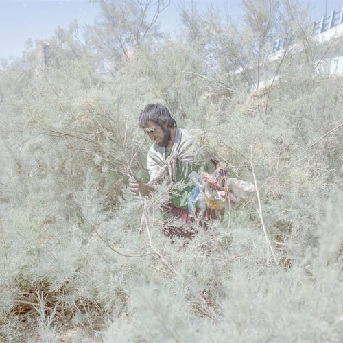 Hoveida, a 30 year old addict, lived next to the Zahak Dam, which was, until recently, full of water. It is now dried up, and only urban sewage flows through it, and it is full of garbage. At only 30 years old, Hoveida says that he is at the end of his rope and hopes to die soon. The Zahak municipality and city council are located are in the near surrounding area. © Hashem Shakeri