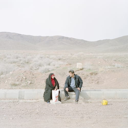 Azizi and his wife, both 44, are spending their Friday in front of their house in the new city of Parand.