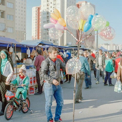 Hossein, 28, is selling balloons on the Thursday Market in the new town of Parand. Parand is located 30 km southwest of Tehran province Hossein’s main profession is cabinet building but just to make ends meet, he has to work as a peddler on the Thursday Market too.